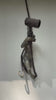 Video of the brass monkey wall lamp mounted on a light wall, showing the hanging monkey, spotlight and wall plate from different angles. A handmade plug-in hanging monkey sconce from Ubud, Bali.