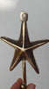 Video of handcrafted brass sea star wall hook being shaped by hand in Bali