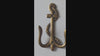 Video showing brass anchor wall hook with nautical coastal design and texture detail