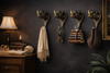 Set of 4 rhino wall hooks on a dark wall, gothic dark academia decor for coats, towels and hats
