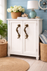 Seahorse cabinet handles installed on coastal furniture drawers nautical brass hardware decor