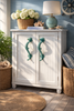 Seahorse drawer pulls installed on coastal cabinet furniture nautical brass hardware accent