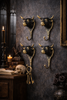 Set of 4 brass bull head wall hooks as statement wall art, functional coat hook set in dark moody decor room