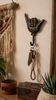 Shaka hand wall hook used as towel hanger in boho bathroom coastal decor