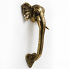 Side profile of brass elephant trunk door handle showing sculptural depth and grip, antique brass hardware, double door handle set and handcrafted entry door hardware