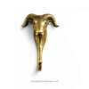 Single brass ram head wall hook front view, animal coat hook for gothic decor