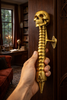 Skull spine door handle shown in a dark academia room setting for gothic interior styling