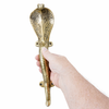 Hand holding solid brass cobra door handle showing size and craftsmanship detail
