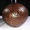 Outdoor string light bulb inside coconut shell lamp shade installation example