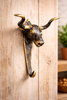 Texas longhorn brass wall hook mounted on light wood, rustic western hook for towels, coats and leashes