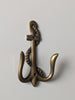 Detailed brass anchor wall hook with vintage finish for coastal and nautical home decor
