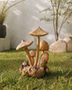 Hand carved wooden mushroom decor placed outdoors in garden, natural wood sculpture earthy home styling