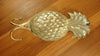 Decorative Gold Brass Pineapple double hook on the table showing the back side