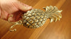 Decorative gold brass pineapple double wall hook in hand