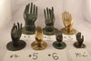 Brass Buddha hand hook size comparison showing multiple sizes including Size #1, Size #2, and smaller options