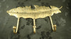 Brass feather wall hook rack with 3 hooks displayed on a dark wall, decorative coat rack and key holder