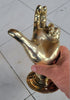 Brass hand hook styled as modern eclectic statement wall decor