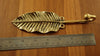 Brass leaf wall hook measured with ruler for accurate size reference