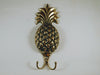 Single brass pineapple wall hook for tropical wall decor