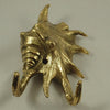 Brass sea shell wall hook installed on wall real photo coastal bathroom hardware