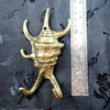 Brass sea shell hook size comparison with ruler showing scale bathroom wall hook