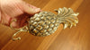 Set of large brass pineapple wall hooks for home organization