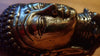 Close up of brass Buddha wall hook texture showing antique finish and handmade detail