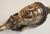 Close up of Buddha head wall hook showing detailed craftsmanship and antique brass finish