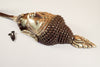 Side profile of brass Buddha wall hook showing depth and curved hook for towels and coats