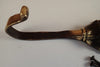 Detailed curved hook arm of Buddha wall hook designed for hanging towels coats and accessories