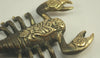 Close-up of antique finish brass scorpion hook