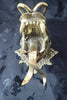 Back view of brass dragon head wall mount showing mounting plate and depth.