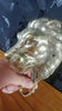 Side view brass lion wall hook showing depth and sculptural design