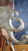 Curved tentacle detail brass octopus wall hook decorative hardware closeup from the back