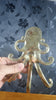 Metal texture close up brass octopus wall hook kraken tentacle detail
