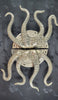 Full view of the large octopus tentacle door pull in gold finish