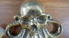 Hand holding patina brass octopus wall hook kraken decor gothic style